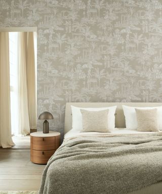 Bedroom with a toile wallpaper accent wall
