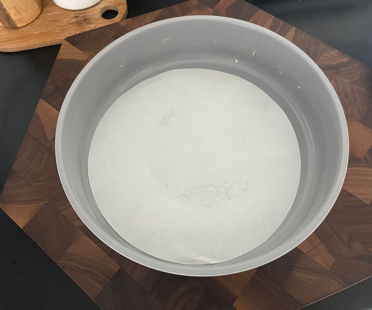 A paper liner in a grey cake tin