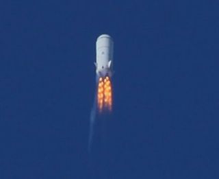 Blue Origin's second test vehicle, a suborbital launch vehicle, soars through Mach 1.2 at 45,000 feet in this image released by the secretive private spaceflight company. This image was taken in August 2011 right before the thrust termination system activated, resulting in the loss of the vehicle, company officials said.