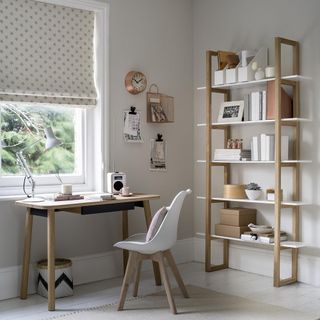 room with wooden table open shelf and white wall