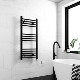 matt black wall-mounted towel radiator in white black and white bathroom