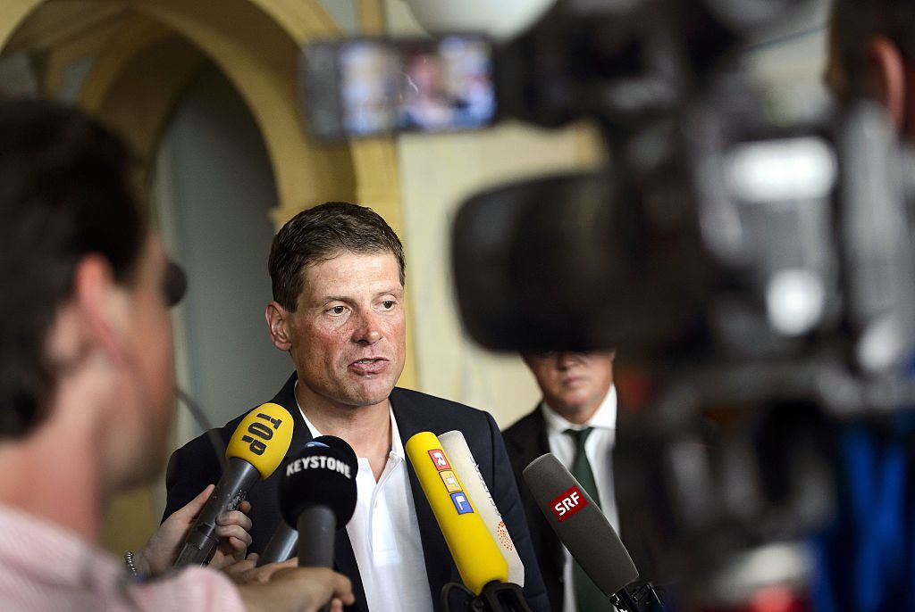 Former German cyclist Jan Ullrich answers journalists&#039; questions after appearing in court in Weinfelden on July 21, 2015 for his involvement in a three-car crash and driving under the influence of alcohol last year. AFP PHOTO / FABRICE COFFRINI