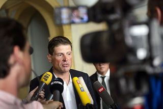 Former German cyclist Jan Ullrich answers journalists' questions after appearing in court in Weinfelden on July 21, 2015 for his involvement in a three-car crash and driving under the influence of alcohol last year. AFP PHOTO / FABRICE COFFRINI
