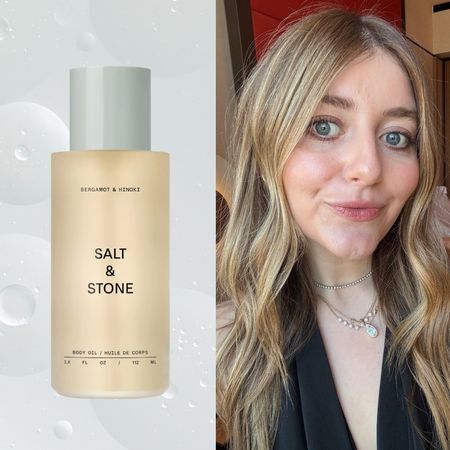 a blonde woman in a black jacket and gold necklace with two salt and stone products on either side of her with a gray background
