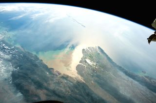 Bright sunlight reflects off the Andaman Sea near the mouth of Myanmar's Irrawaddy river delta in this photo taken by an astronaut at the International Space Station. By pointing a camera at the "sunglint point," or the spot where sunlight reflects off the Earth and directly into the camera, astronauts can capture photos that emphasize the details of Earth's shorelines.