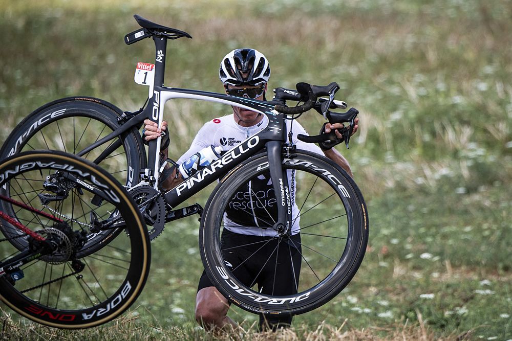 Chris Froome (Team Sky) loses time after crashing into a ditch during stage 1