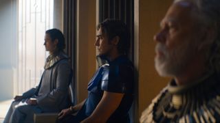 Still from the sci-fi TV show Foundation which is based on the award-winning science fiction book series by Isaac Asimov. Here we see Brother Dawn, Brother Day and Brother Dusk sitting on thrones.