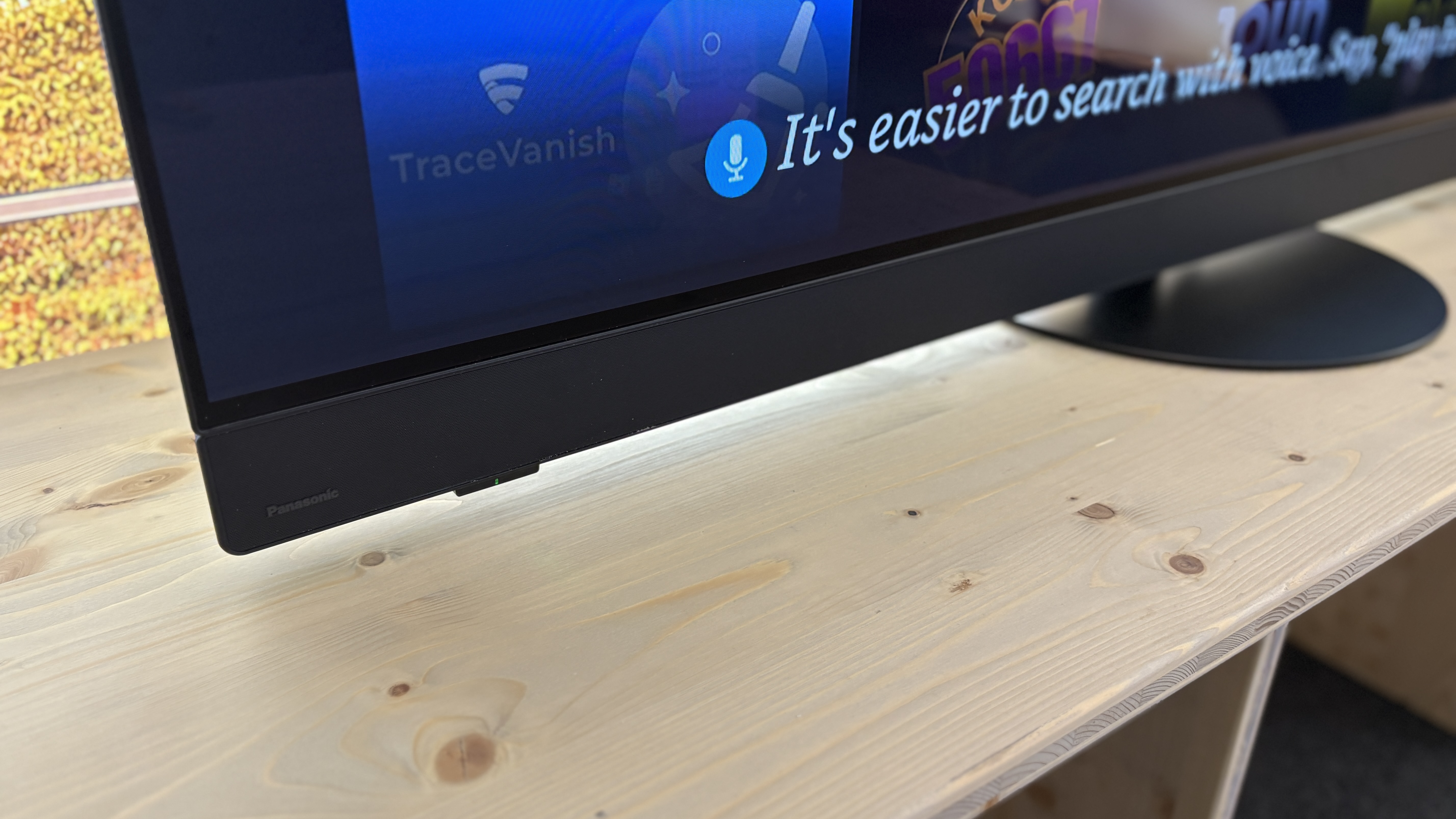Panasonic Z90B OLED TV on a wooden side table.