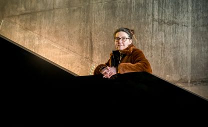 Ellen van Loon photographed on a main stairway in the new Blox Building she has designed in Copenhagen to house the Danish Architecture Centre, among other functions