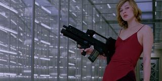 Milla Jovovich holding a gun in 2002's Resident Evil