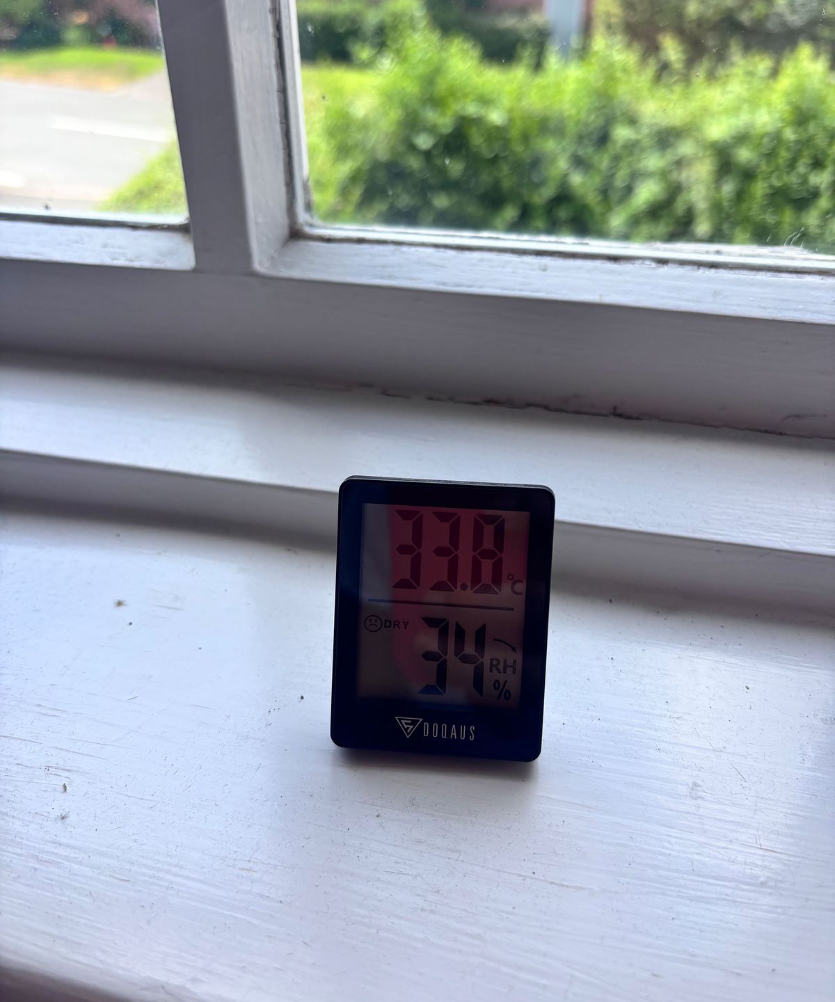 digital thermometer on window sill