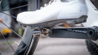 An S-Works Recon shoe clipped into an SPD pedal which is fitted to a bike