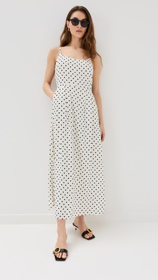 white sleeveless midi dress with black polka dots