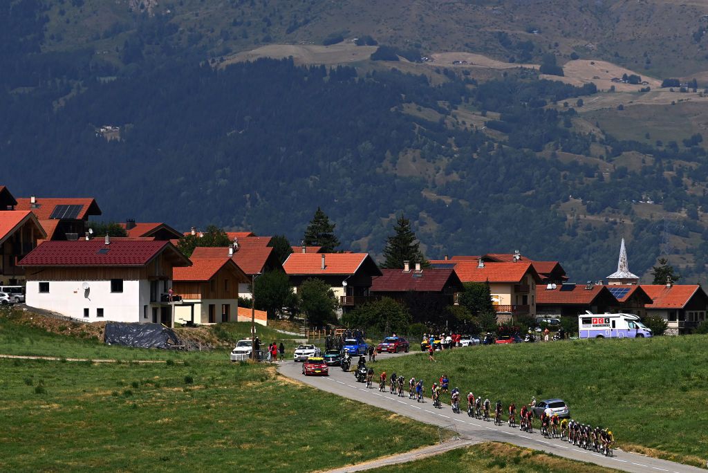 COURCHEVEL FRANCE JULY 19 Jonas Vingegaard of Denmark and Team JumboVisma Yellow Leader Jersey Tadej Pogacar of Slovenia and UAE Team Emirates White Best Young Rider Jersey and a general view of the peloton competing during the stage seventeen of the 110th Tour de France 2023 a 1657km at stage from SaintGervais MontBlanc to Courchevel UCIWT on July 19 2023 in Courchevel France Photo by Tim de WaeleGetty Images