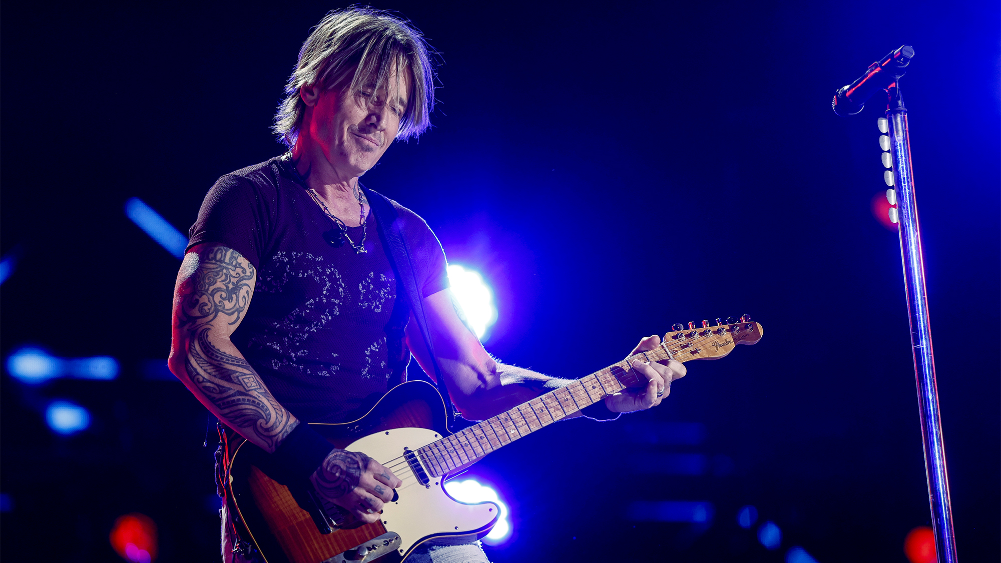 Keith Urban performs onstage during the 2024 CMA Music festival at the Nissan Stadium on June 08, 2024 in Nashville, Tennessee.