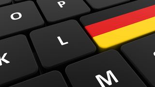 Computer keyboard with a German flag instead of a Return key