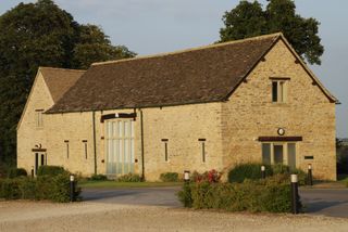 converted stone barn exterior with new windows