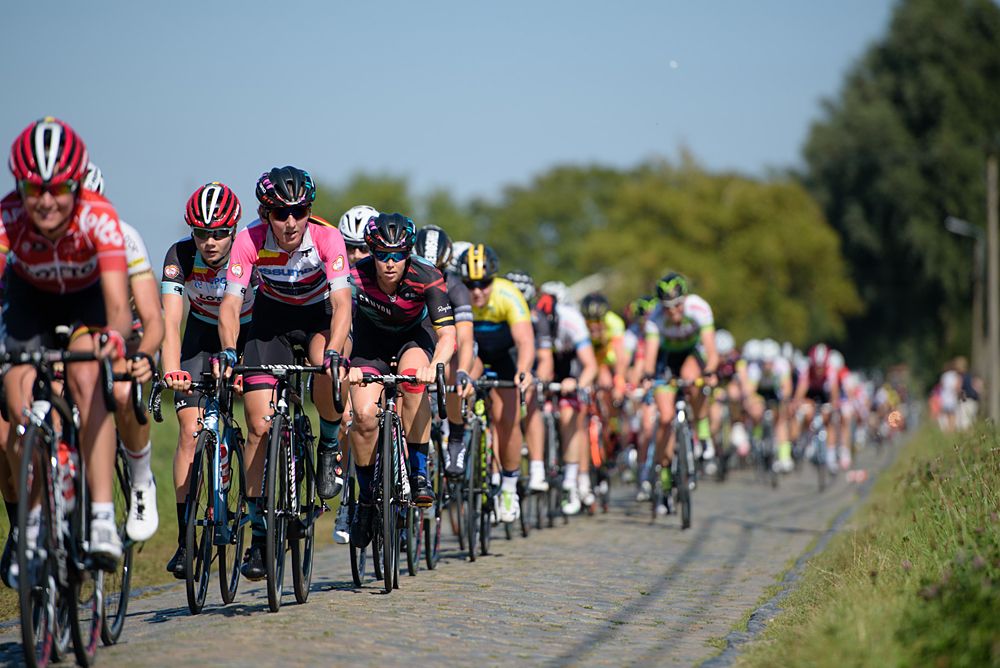 Lisa Brennauer (CANYON//SRAM Racing) across the cobbles on the road back to Moorslede at the 121 km Stage 1 of the Lotto Belgium Tour 2016