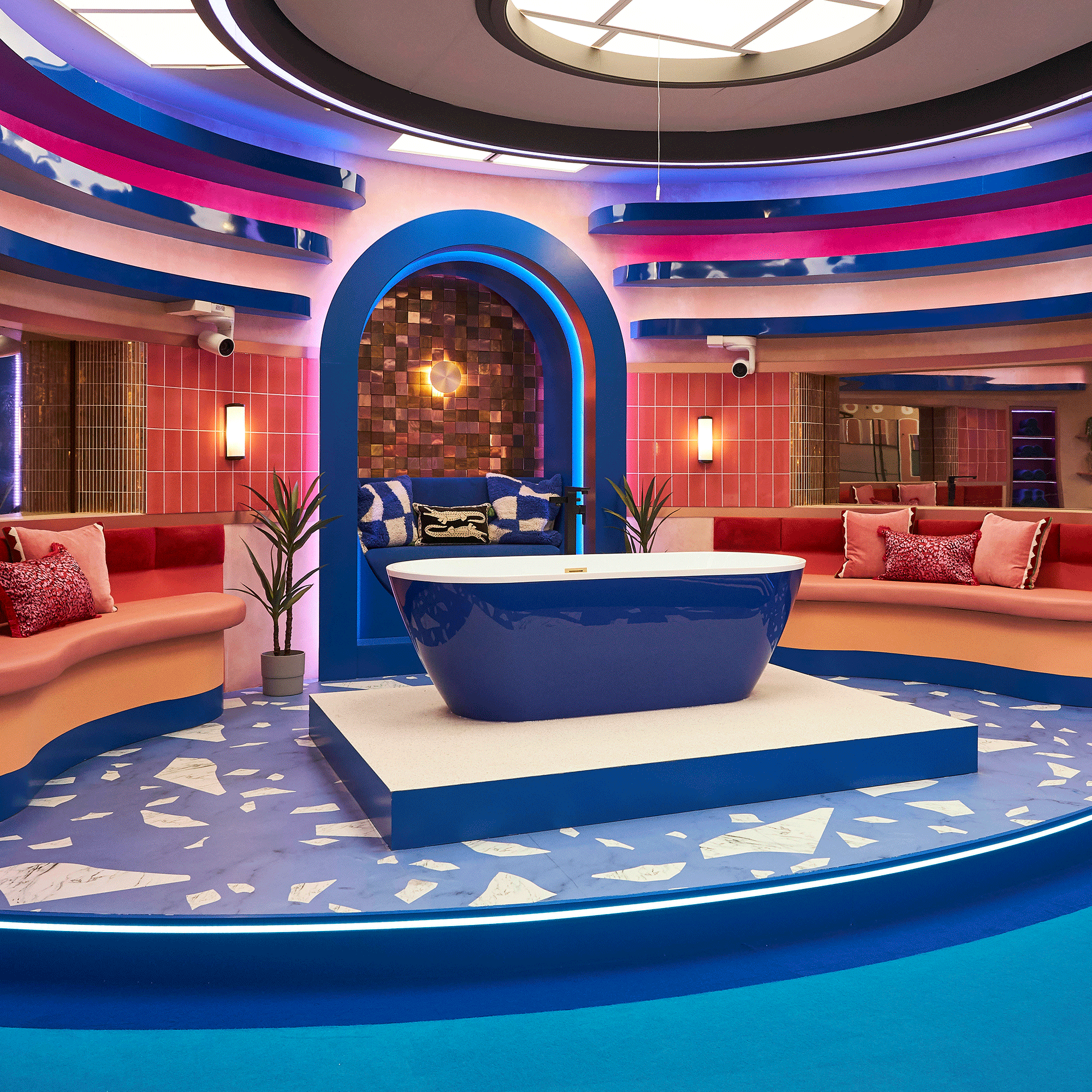 Big Brother house bathroom with blue bathtub