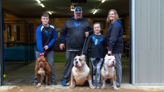 Giant Bully dog Romper with his family at ProBulls