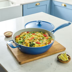 Aldi everways pan in blue. It's ona kitchen counter and is filled with cooked stir fry