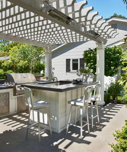 5 rustic outdoor kitchen ideas for a harmonious backyard | Homes & Gardens