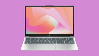 HP 15 inch laptop against a pink background