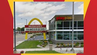 A McDonald's sign with just one golden arch