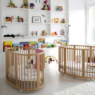 kids room with cradle and toys shelves