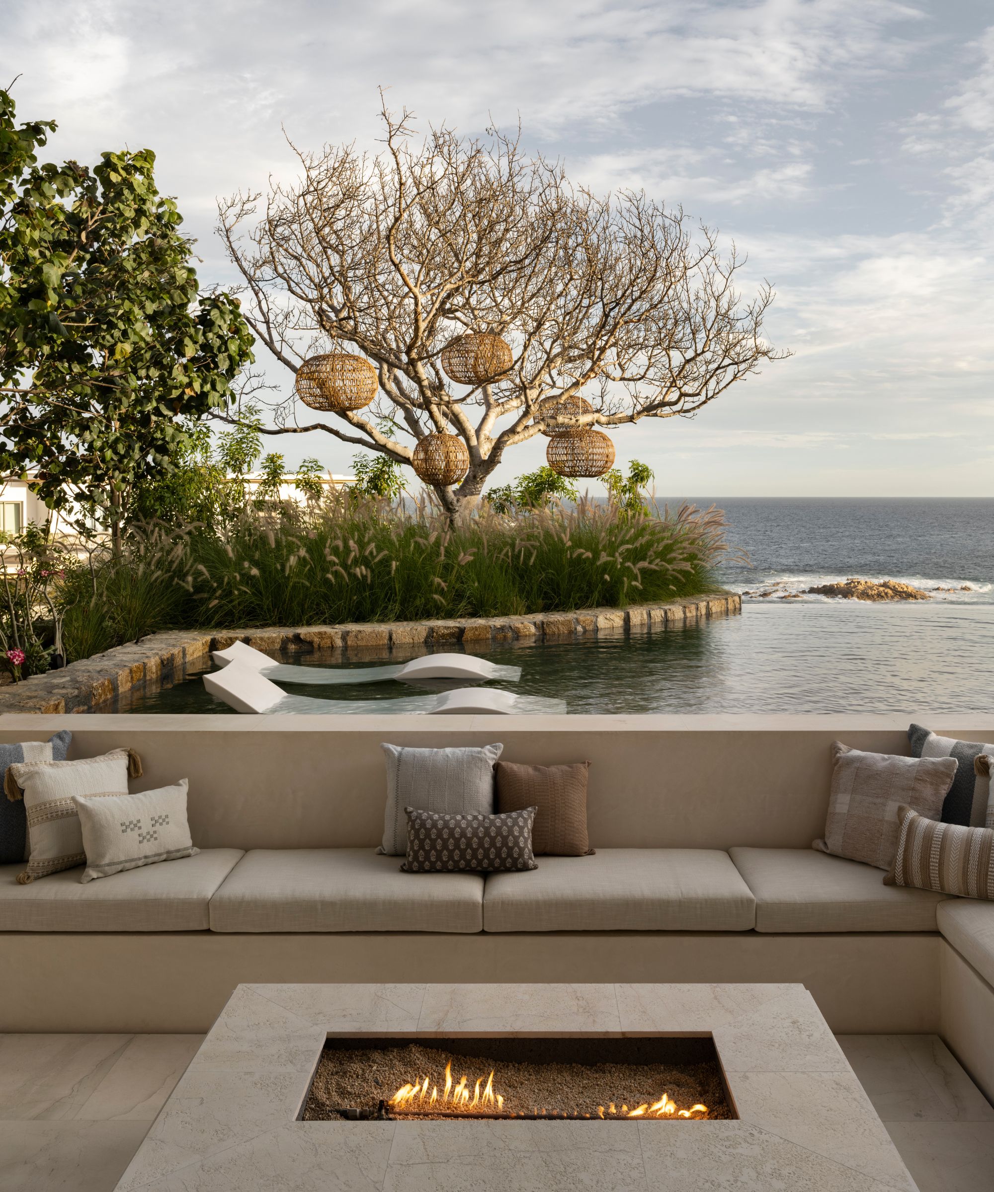 Outdoor seating area with built-in seating and a fire pit