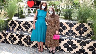 Kate Holmes stands with Beanie Feldstein for a photo
