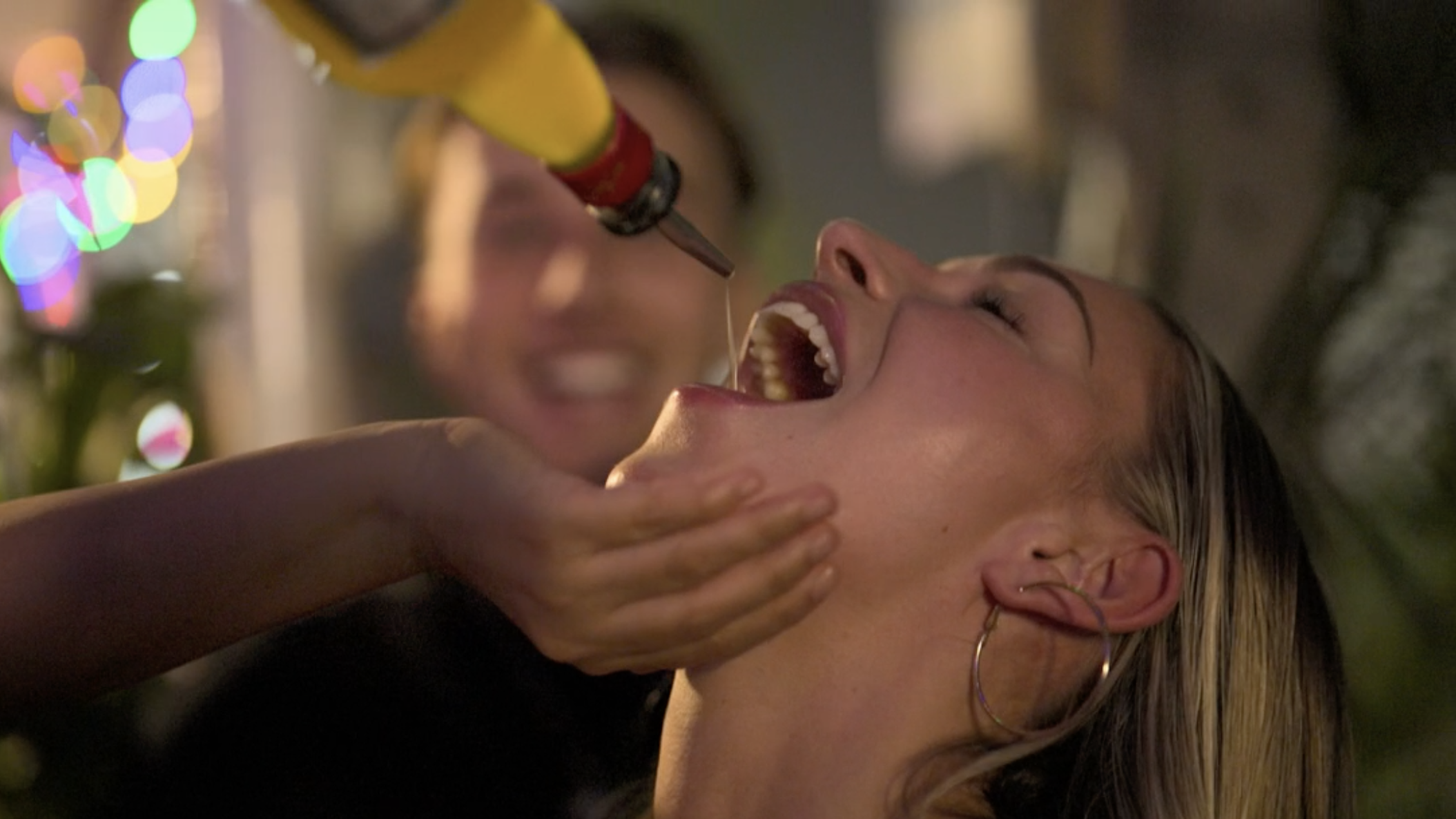 Zara McDermott takes a shot of liquor in a scene from her viral Bangkok documentary series, Thailand: Dark Side of Paradise (2025)