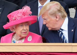 Queen Elizabeth II (L) reacts as she sits with US President Donald Trump an event to commemorate the 75th anniversary of the D-Day landings, in Portsmouth, southern England, on June 5, 2019