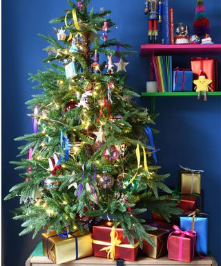 Colourful christmas tree with bows and presents