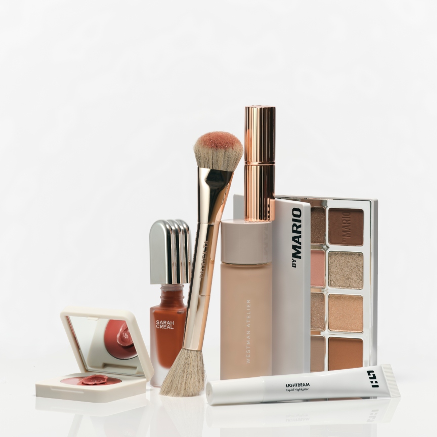an assortment of makeup products on a white background