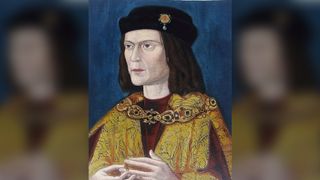 Portrait of King Richard III of England, painted c. 1520. He has pale skin and has shoulder-length brown hair. He's wearing a black hair with a gold emblem on it. He's also wearing red and gold robes.