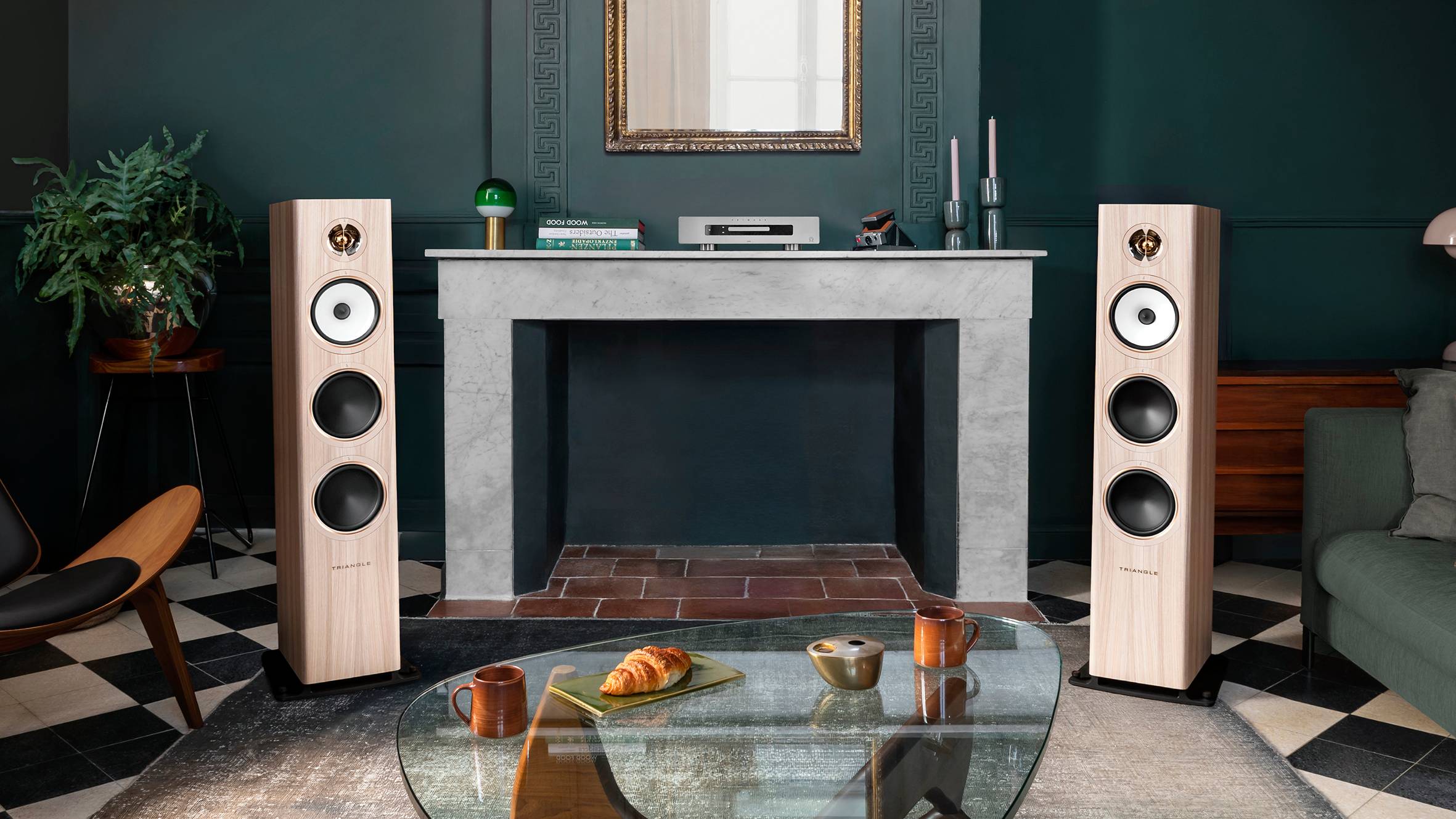 A pair of Triangle Solstice 8 speakers straddling an empty fireplace.