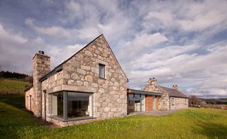 Stuart Archer designed and built this stunning home using a mixture of reclaimed stone and contemporary glazing