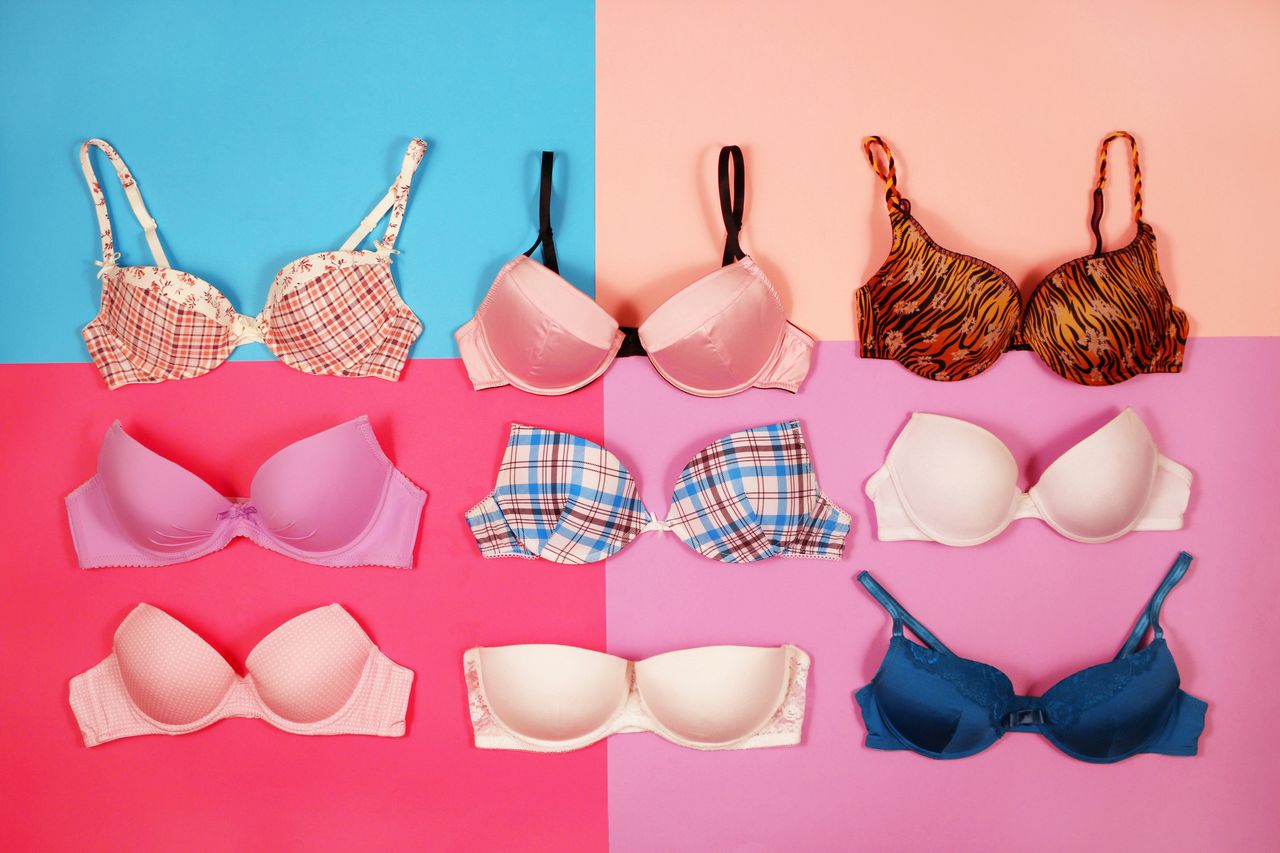 Set of different bras on multicolored background demonstrating the different design options of a custom bra