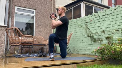Fit&Well fitness writer Harry Bullmore performing a half-kneeling kettlebell rotation