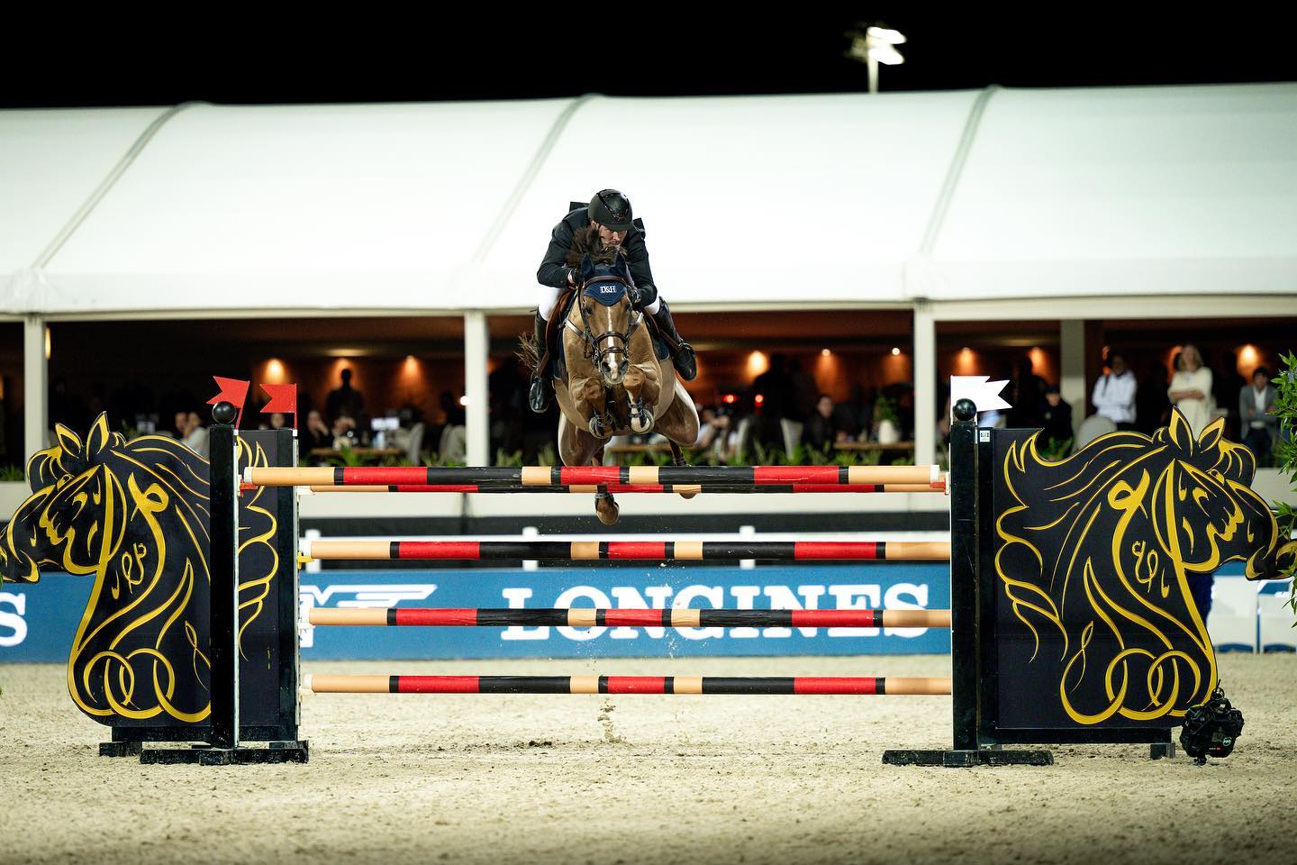 Joe Whitaker and Huluhupe JR winning the World Cup at the Al Shira'aa International Horse Show