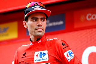 Tom Dumoulin in red on the stage 10 podium.