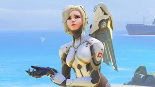 Mercy from Overwatch 2, an angelic healer in tech armour, looks upwards in a baffled fashion.