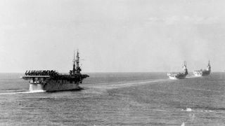 Three aircraft carriers proceed full steam ahead during the NATO exercise "Mainbrace" in the North Sea, in September 1952. Left to right: USS Wright, HMS Illustrious and HMS Eagle.