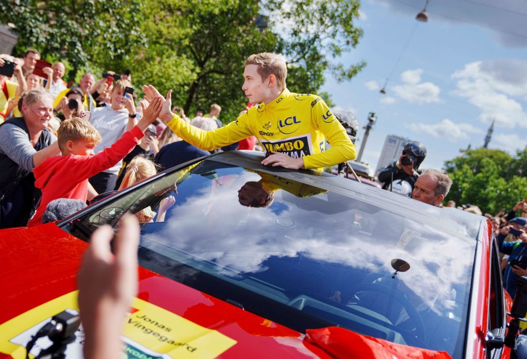 Jonas Vingegaard high fives a young fan