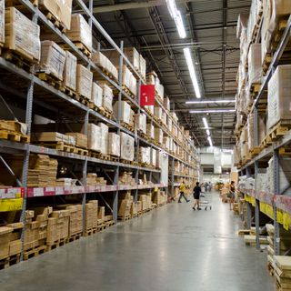 Ikea warehouse with trolley and people