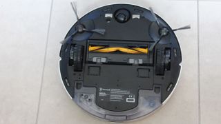 Ecovacs Deebot Ozmo N8+ upside down with the mopping pad removed