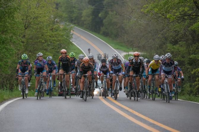 The women's peloton crests a rolling hill characteristic of the circuit in pursuit of the day's breakaway. The women raced in a light rain, which turned to thick, wet fog for the men's race.