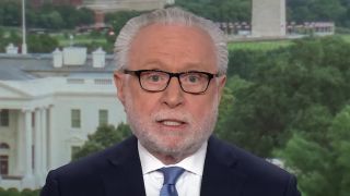 Wolf Blitzer speaking to the camera introducing J.D. Vance interview on CNN
