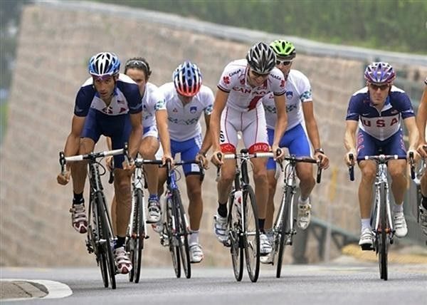 Riders from various teams tackle the climb near China's Great Wall